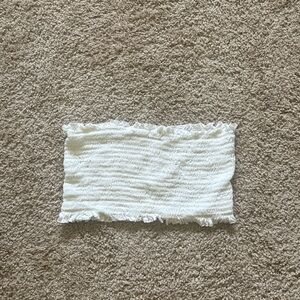 Small white tube top, cropped.